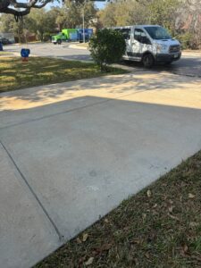 The Service Being Done Is Pressure Washing The Concrete Driveway To Remove Dirt And Stains From The Surface